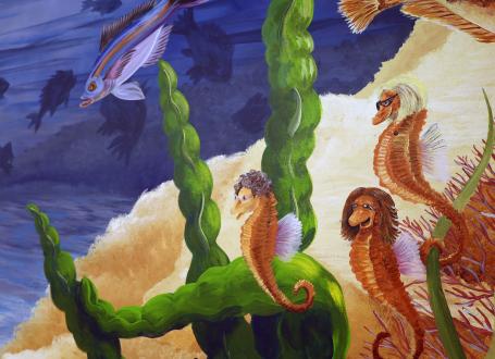 Three seahorses are pictured in the large, Youth Services mural. These seahorses are based on three librarians that used to work at the library.