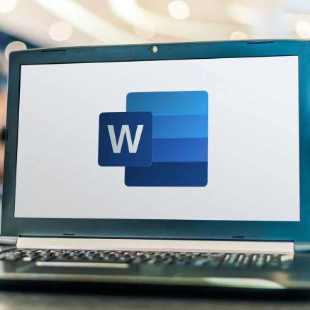 The Microsoft Word logo on a laptop screen.