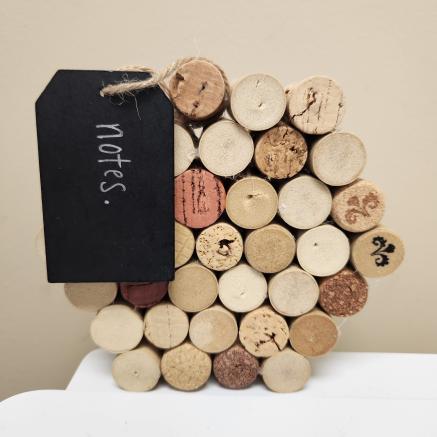 A hexagonal corkboard made of wine corks.