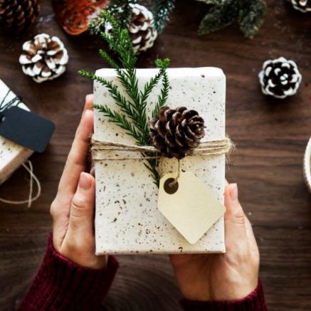 White Package with Pine Cone and Greenery