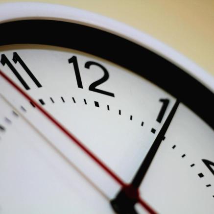 Close up of hands on a clock