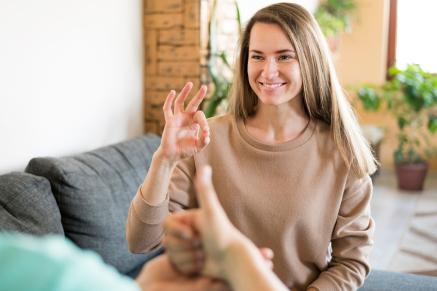 Woman using Sign Language to communicate 