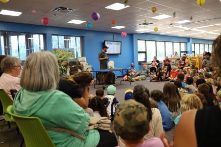 Eyes of the Wild presents an arctic fox to a crowd of kids and families